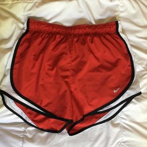red Nike shorts